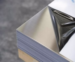 Close-up view of stainless steel sheet edge showing precise thickness tolerance