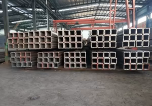 seamless carbon steel pipe supplier YIER storage yard with stacked black seamless pipes